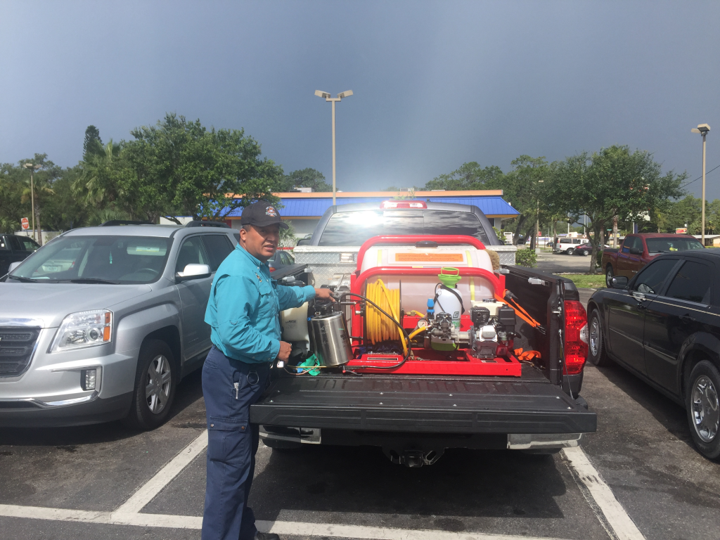 Licensed pest control technician inspecting a home in Southwest Florida