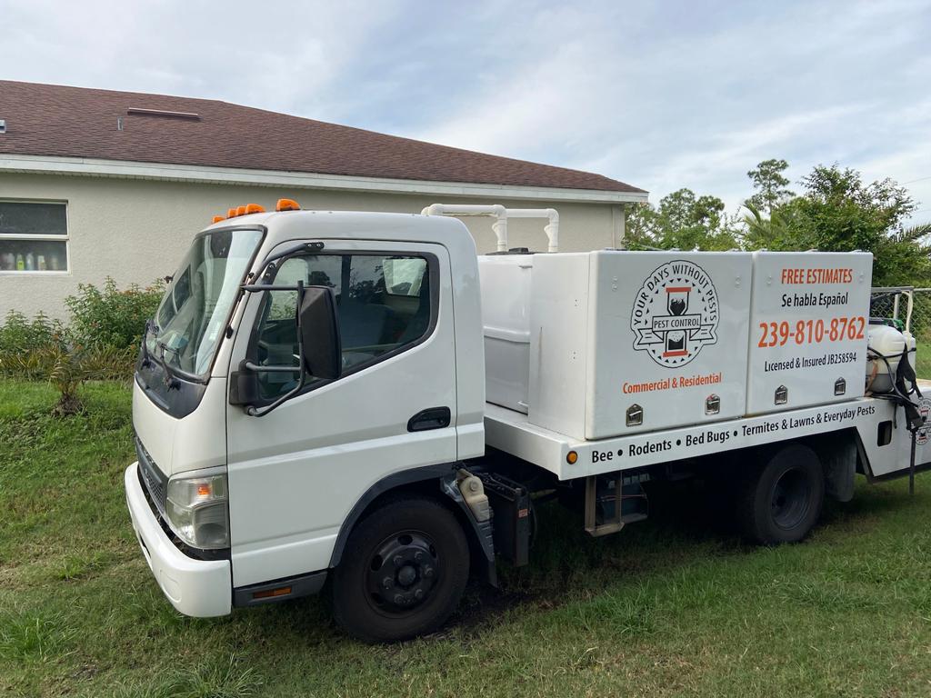 YDWP branded truck with Free Estimates and the phone number parked outside a client home